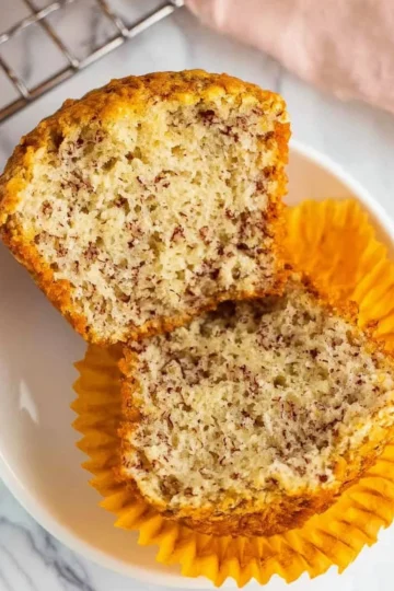 Freshly baked banana muffins on a kitchen counter