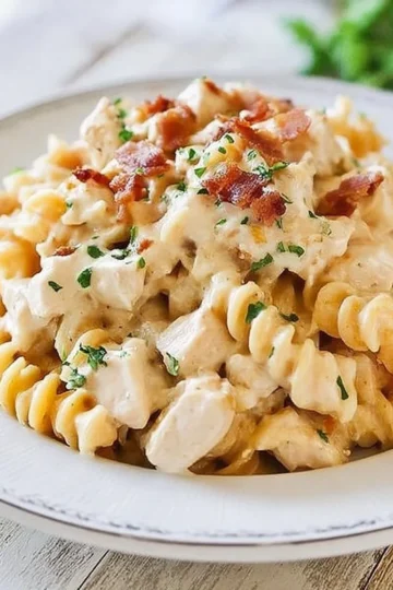 Delicious Chicken Bacon Ranch Pasta served in a bowl with fresh herbs