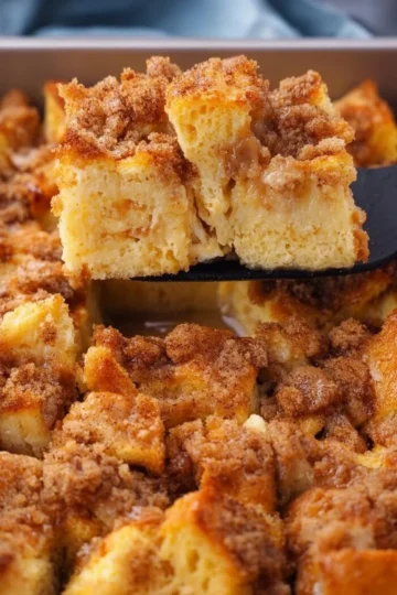 Delicious Easy French Toast Bake with syrup and fresh berries on a plate.