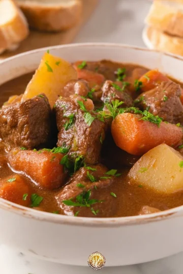 Bowl of easy homemade beef stew with vegetables and herbs