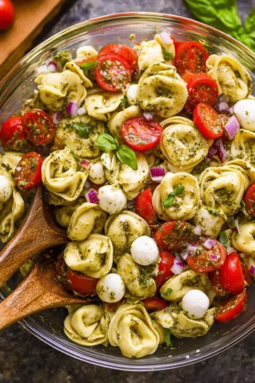 Easy pesto tortellini pasta salad with fresh vegetables and basil pesto dressing