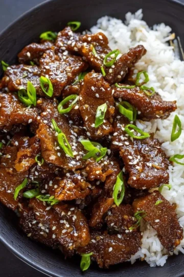 Delicious homemade Mongolian Beef served with rice and vegetables
