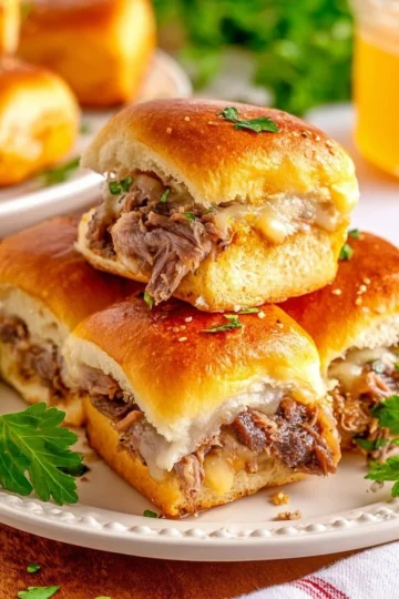 Delicious roast beef sliders served on a platter with fresh ingredients