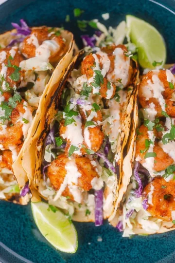 Delicious shrimp tacos with fresh toppings and colorful ingredients