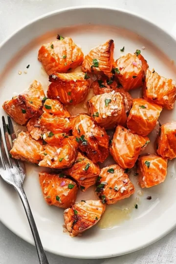 Crispy air fryer salmon bites served on a plate