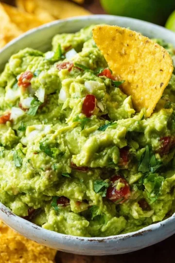 Bowl of authentic guacamole made with fresh avocados and spices