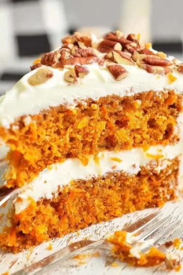Delicious slice of homemade Carrot Cake with cream cheese frosting