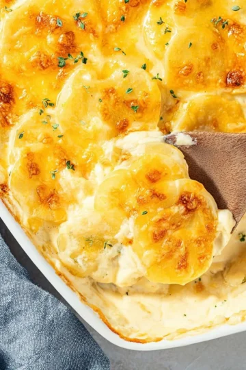 Creamy cheese scalloped potatoes baked to perfection.