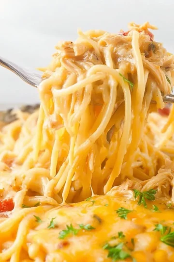Delicious Chicken Spaghetti Casserole served in a bowl with herbs