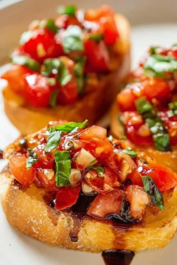 Classic bruschetta topped with tomatoes, basil, and garlic on toasted bread