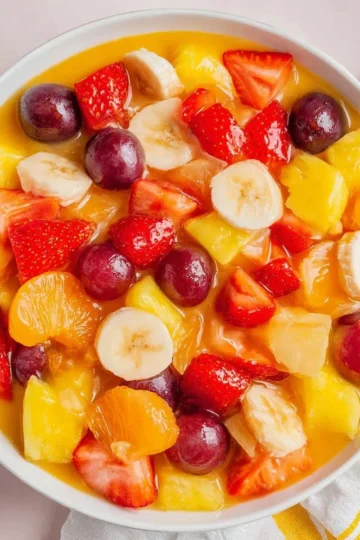 Creamy fruit salad with vanilla pudding and colorful fresh fruits
