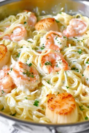 Delicious creamy seafood pasta with shrimp and scallops in a rich sauce