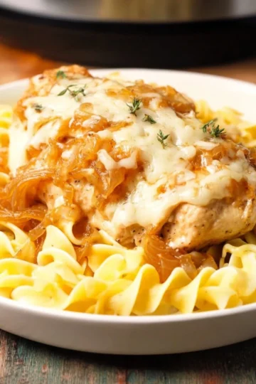 Crock Pot French Onion Chicken served with melted cheese and crispy bread