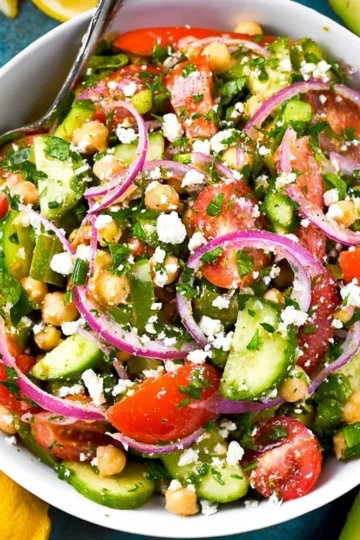 Colorful easy chickpea salad with vegetables and dressing