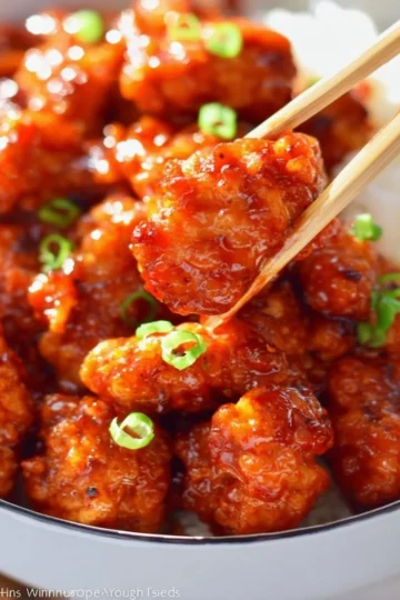 Plate of easy orange chicken with rice and vegetables