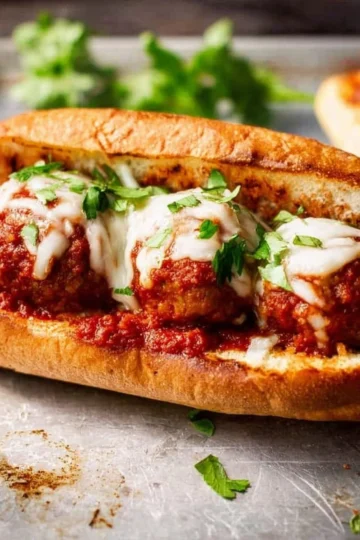 Delicious homemade Italian meatball sub loaded with marinara sauce and cheese