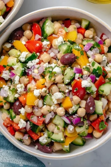 Colorful Mediterranean Dense Bean Salad with fresh vegetables and herbs