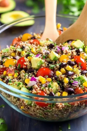 Mexican quinoa salad with diced avocado and colorful vegetables.