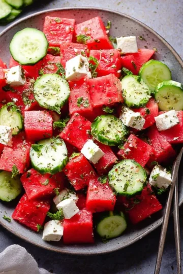 Delicious watermelon salad with cucumber served in a bowl