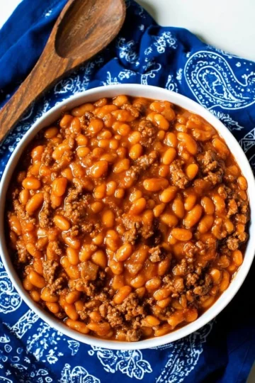 A delicious serving of cowboy beans with spices and ingredients.