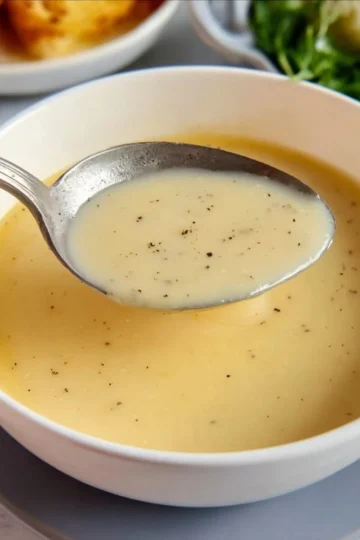 Delicious easy chicken gravy poured over roasted chicken and mashed potatoes.