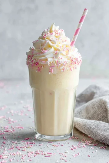 Delicious homemade milkshake recipe with whipped cream and cherry on top