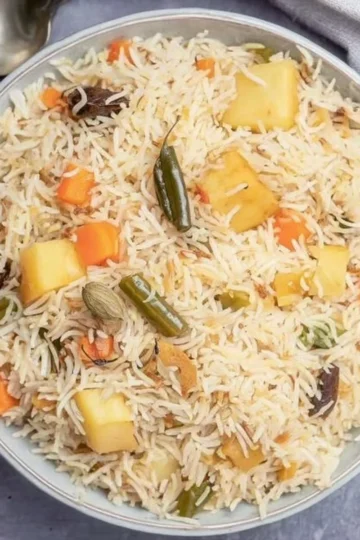 Colorful one pot vegetable pilaf with fresh vegetables and spices