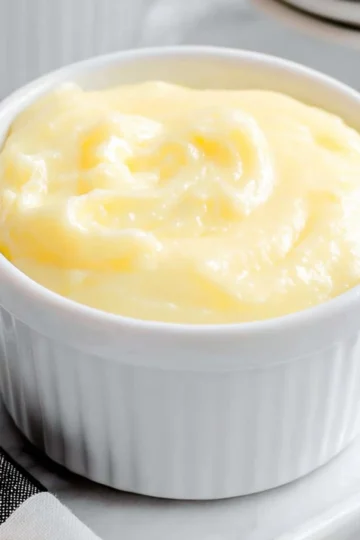 Delicious bowl of homemade Vanilla Custard topped with a sprinkle of nutmeg.